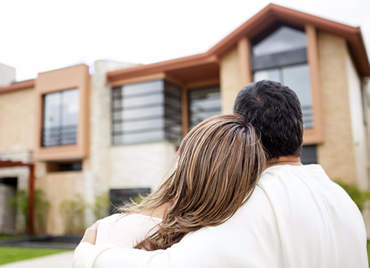 Happy couple looking at home